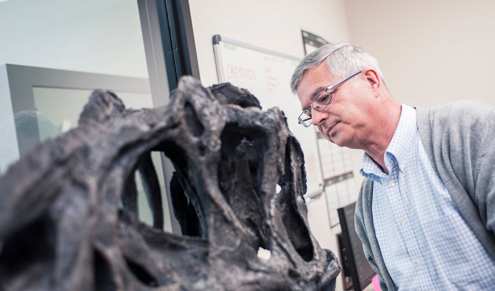 Dr. Andrew Snelling with Allosaurus Skull