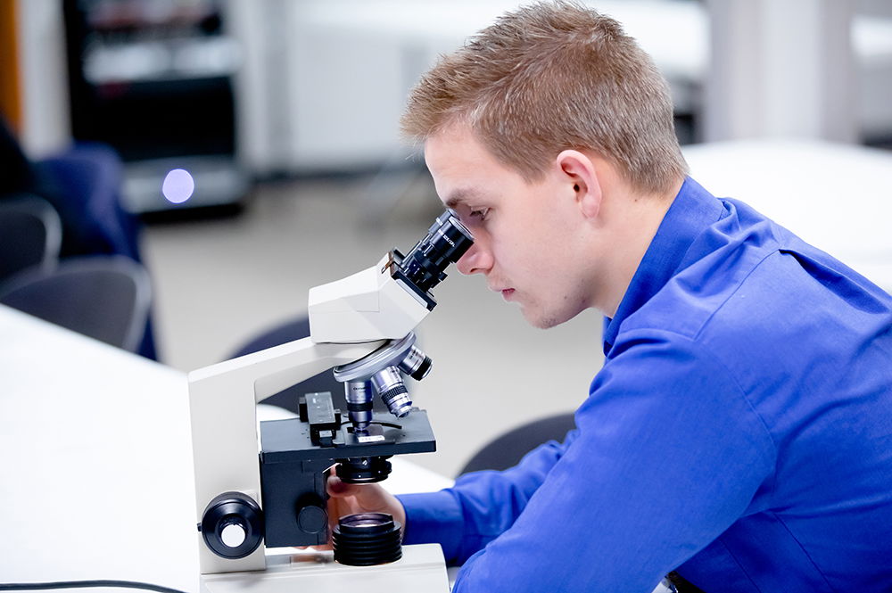 Student Using Microscope