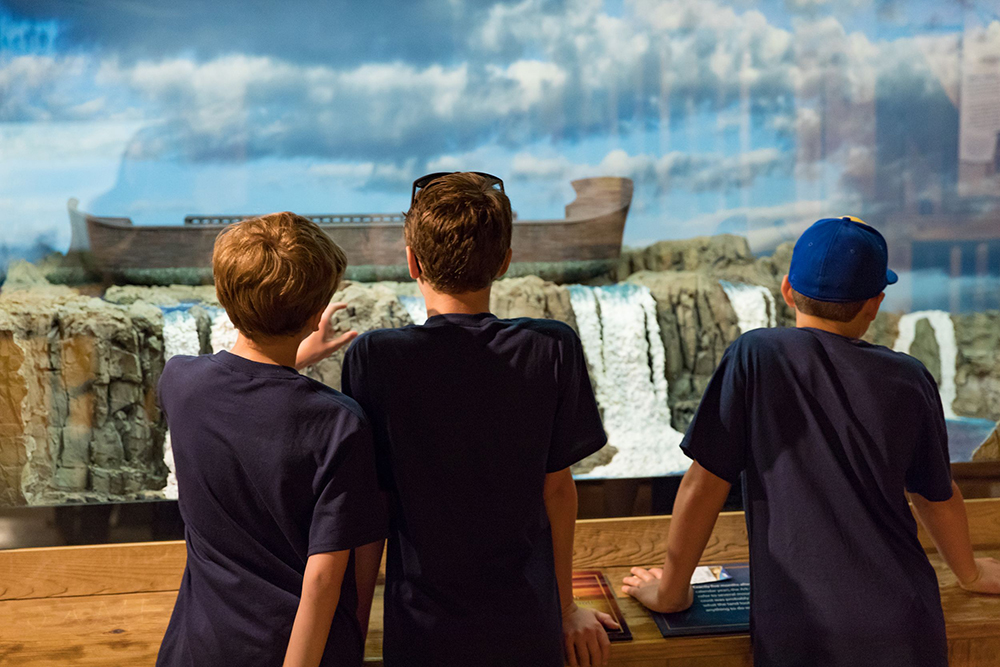 Guests Looking at Noah’s Ark Flood Diorama